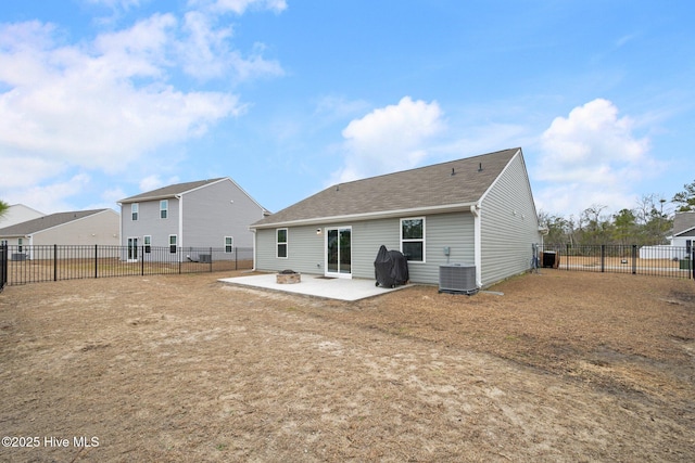 rear view of property featuring central AC and a patio