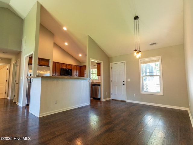 kitchen with visible vents, black microwave, vaulted ceiling, dark wood finished floors, and dishwasher