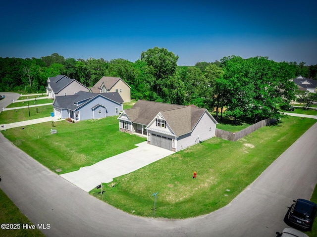 drone / aerial view featuring a view of trees