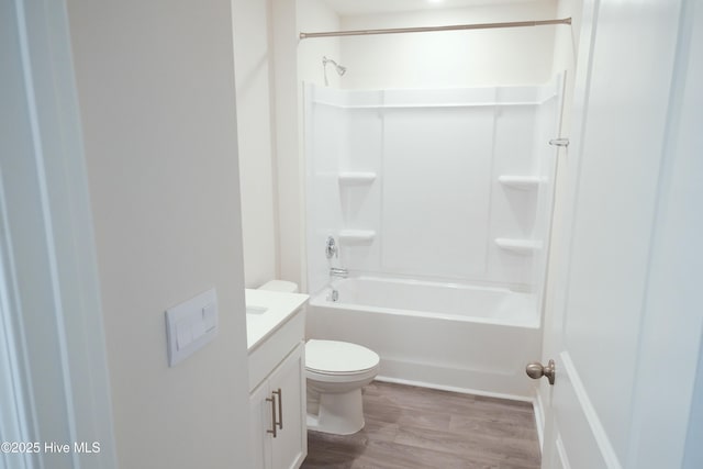 full bathroom with vanity, wood-type flooring, bathtub / shower combination, and toilet