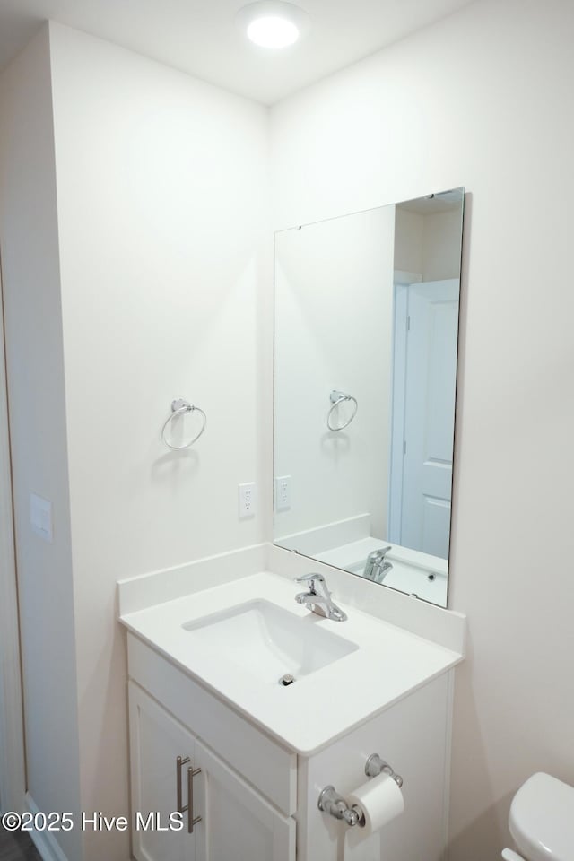 bathroom with vanity and toilet