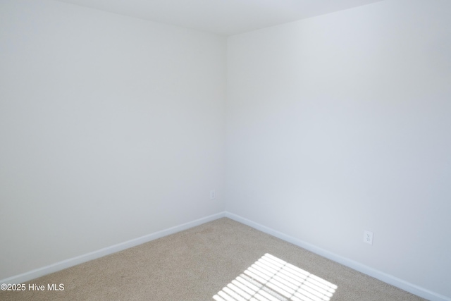 spare room with light colored carpet