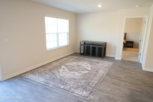 spare room featuring hardwood / wood-style floors