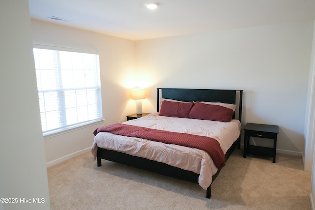 bedroom with light carpet