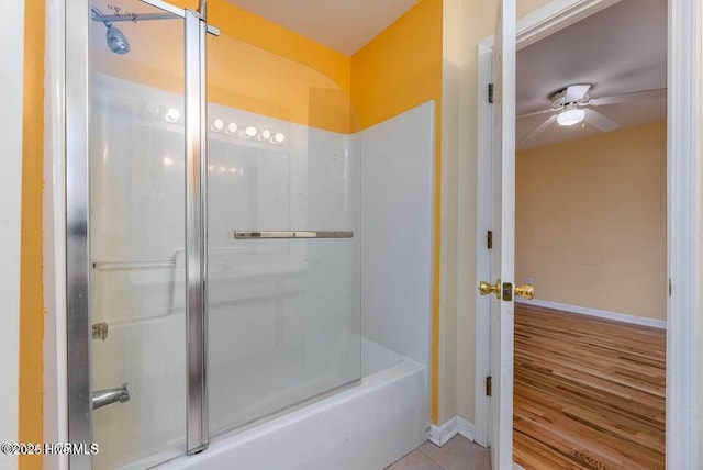 bathroom with enclosed tub / shower combo, tile patterned floors, and ceiling fan