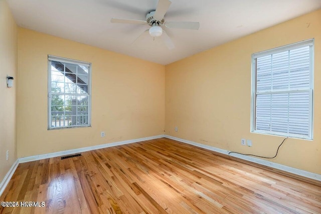 unfurnished room featuring ceiling fan and light hardwood / wood-style floors