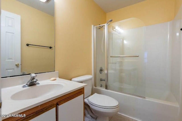 full bathroom featuring bath / shower combo with glass door, vanity, and toilet