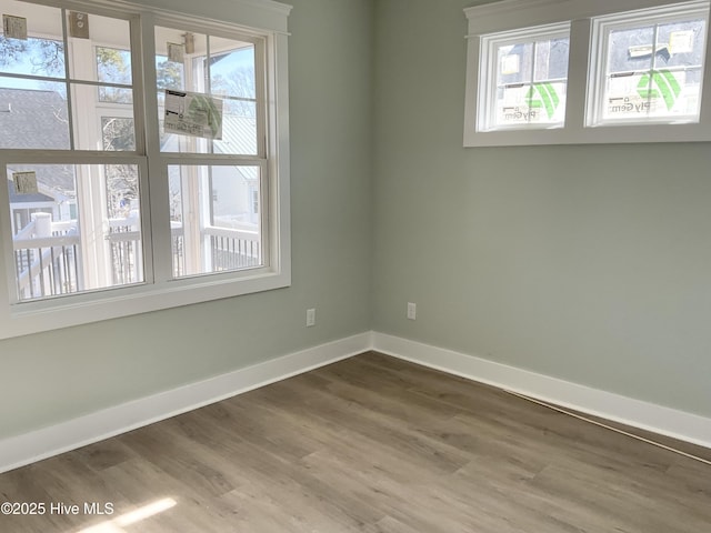 spare room featuring hardwood / wood-style floors