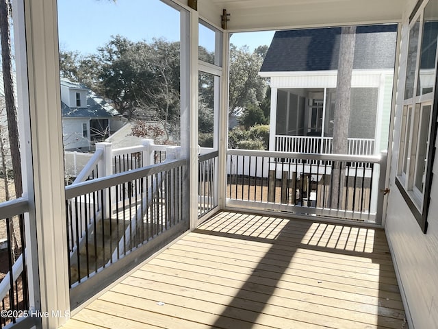 wooden terrace featuring a sunroom