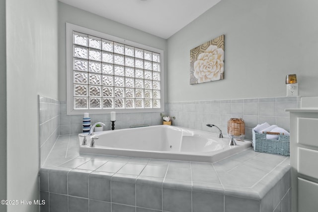 bathroom featuring tiled tub