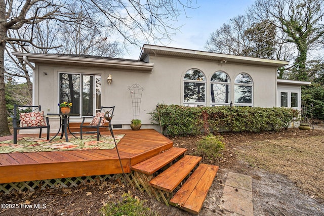 rear view of house with a deck