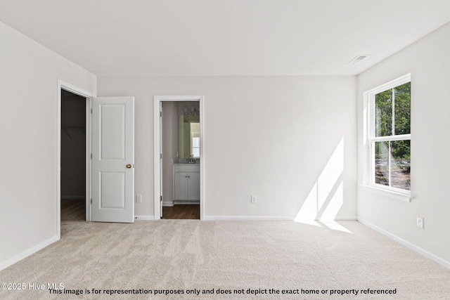 empty room with light colored carpet