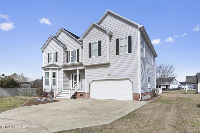 traditional home with a garage, concrete driveway, and fence