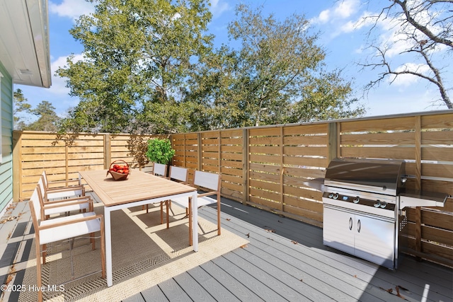 wooden terrace featuring grilling area