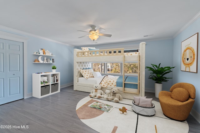 interior space with crown molding, ceiling fan, and hardwood / wood-style floors