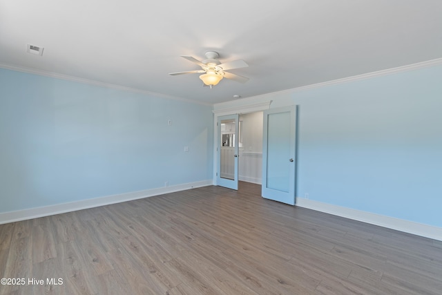 unfurnished room with crown molding, ceiling fan, and light hardwood / wood-style flooring