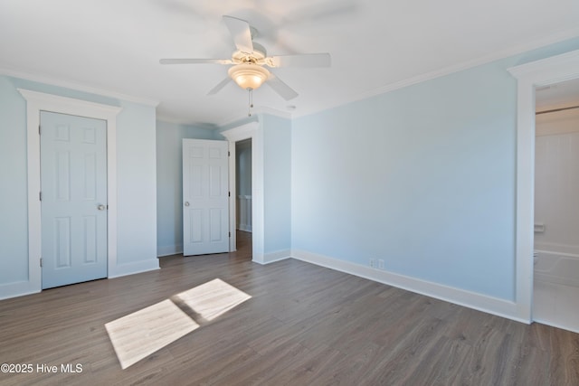 unfurnished bedroom featuring hardwood / wood-style flooring, ceiling fan, ornamental molding, and ensuite bath