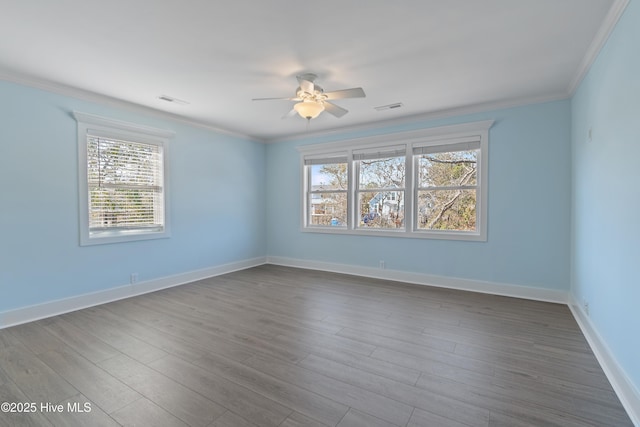 unfurnished room featuring wood-type flooring, ornamental molding, and ceiling fan