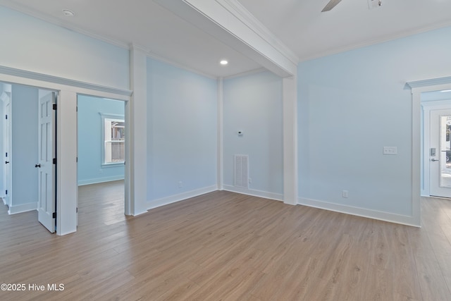 unfurnished room with ornamental molding, ceiling fan, and light wood-type flooring