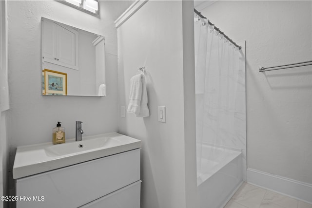 bathroom featuring shower / bath combination with curtain and vanity