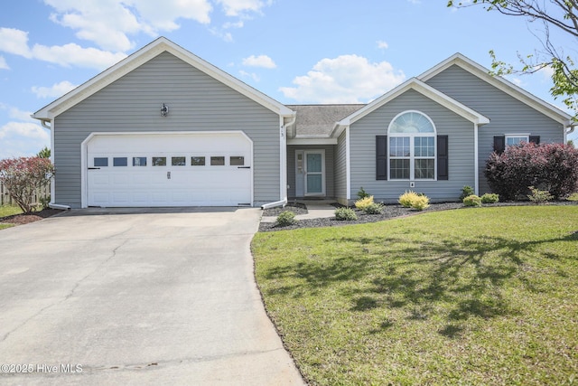 ranch-style home featuring a garage and a front yard