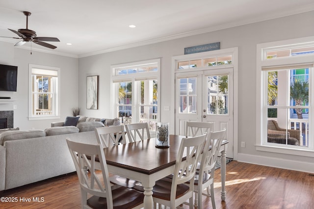 dining area with ceiling fan, ornamental molding, and dark hardwood / wood-style floors