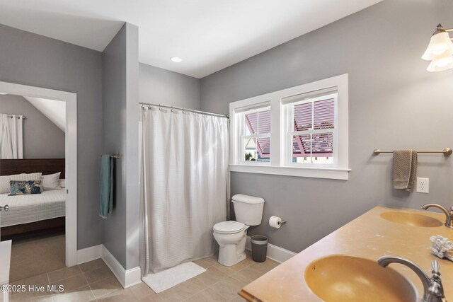 bathroom with vanity, a shower with shower curtain, tile patterned floors, and toilet