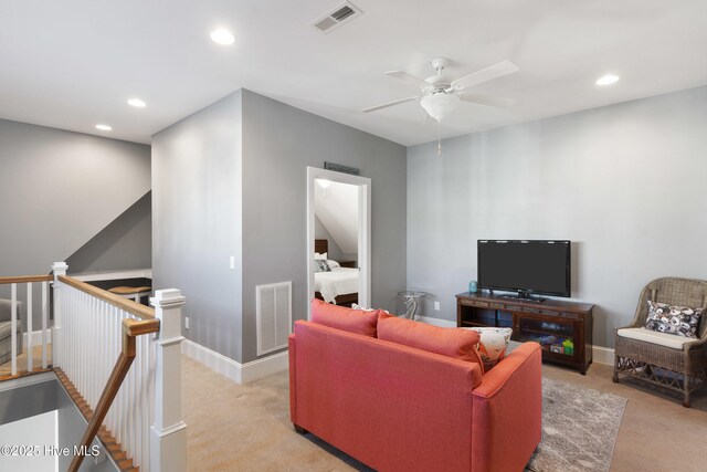 living room with light carpet and ceiling fan