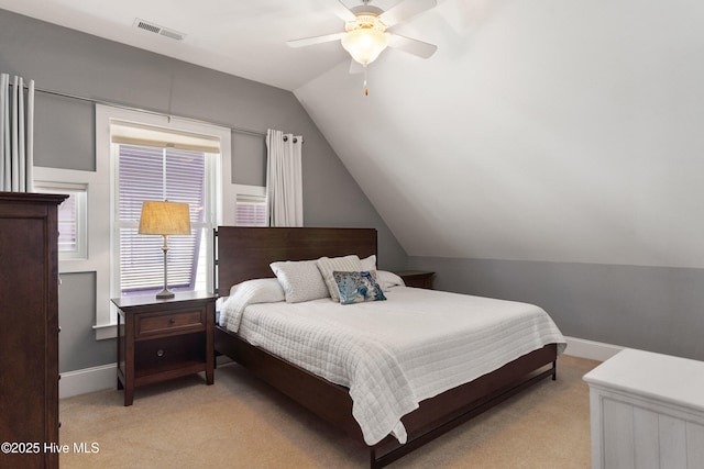 carpeted bedroom with lofted ceiling and ceiling fan