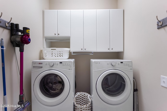 laundry area with cabinets and washer and dryer