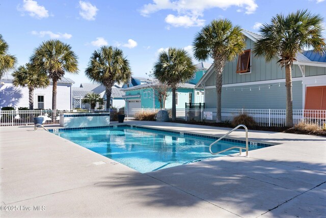 view of pool with a patio and french doors