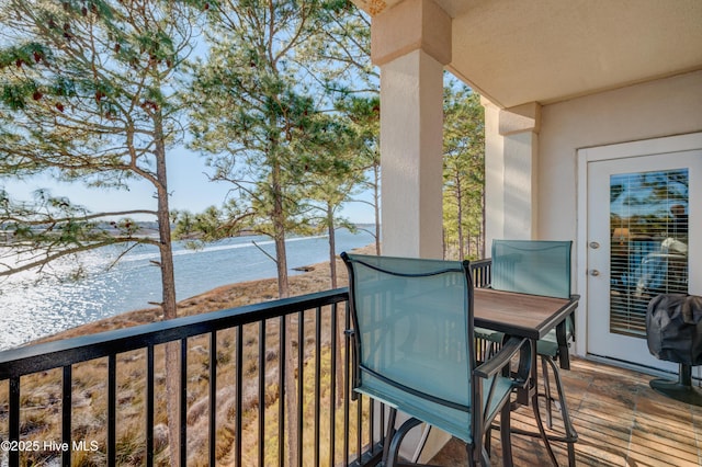 balcony featuring a water view