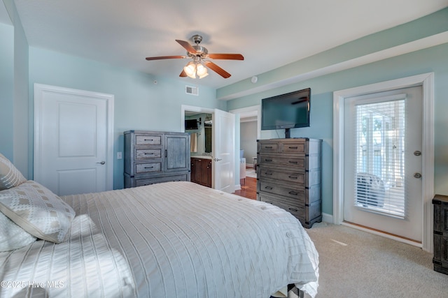 bedroom featuring visible vents, ceiling fan, light carpet, and baseboards