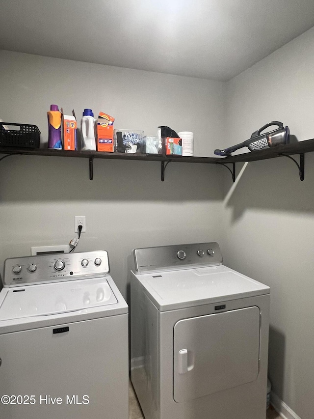 laundry room featuring washing machine and clothes dryer