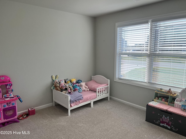 bedroom featuring light carpet