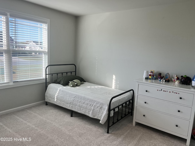 bedroom with light carpet