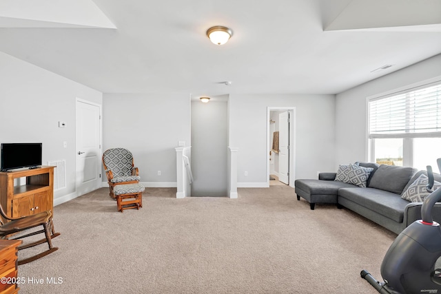 living room featuring light carpet