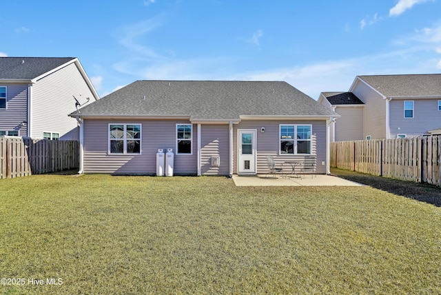 back of property featuring a yard and a patio area