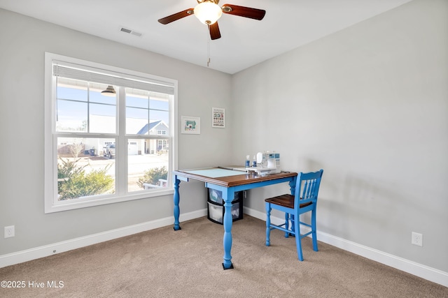 carpeted office with ceiling fan