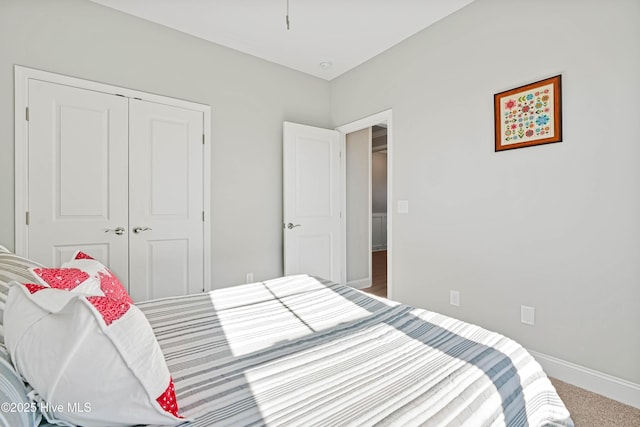 carpeted bedroom with a closet