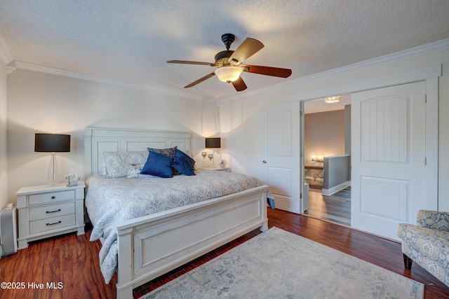 bedroom featuring crown molding, dark wood-type flooring, and a textured ceiling