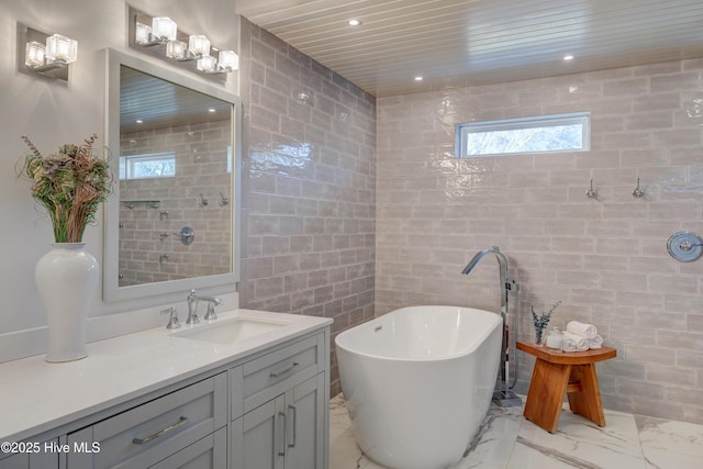 bathroom with tile walls, vanity, wooden ceiling, and a bathing tub