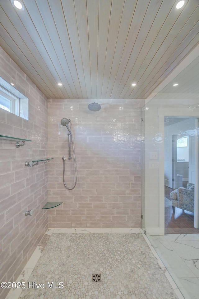 bathroom with a tile shower