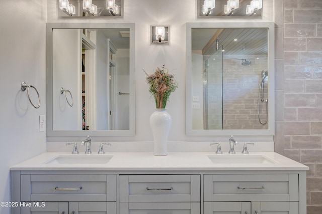 bathroom featuring vanity and an enclosed shower