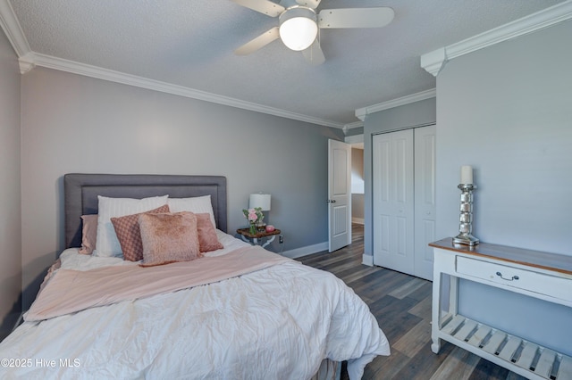 bedroom featuring crown molding, dark wood-type flooring, a closet, and a textured ceiling