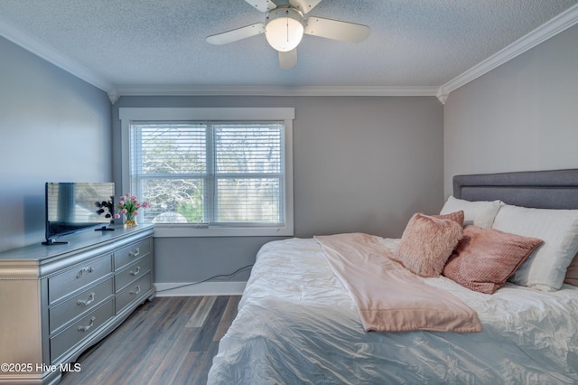 bedroom with dark hardwood / wood-style flooring, ceiling fan, ornamental molding, and a textured ceiling