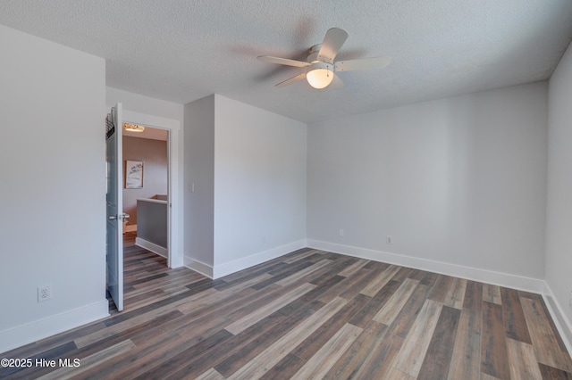 unfurnished room with a textured ceiling, dark hardwood / wood-style floors, and ceiling fan