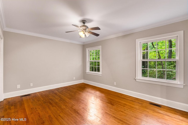 unfurnished room with hardwood / wood-style flooring, ceiling fan, and ornamental molding