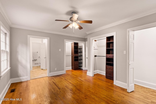 unfurnished bedroom with crown molding, light hardwood / wood-style floors, ceiling fan, and ensuite bathroom