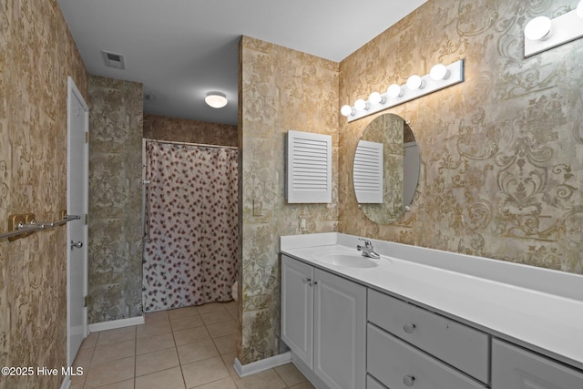 bathroom with vanity, tile patterned floors, and walk in shower